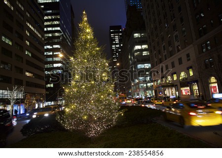 Holiday Christmas tree glowing from the center of Park Avenue in Midtown Manhattan, New York City