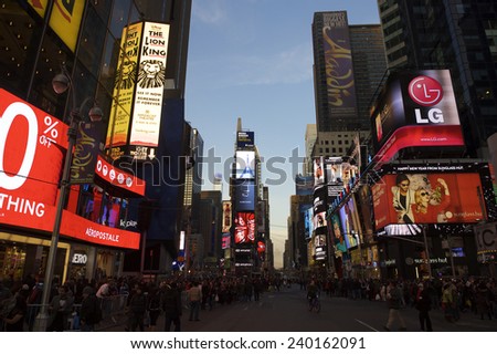 NEW YORK, USA - DECEMBER 27, 2014: Crowds gather under the bright lights of Times Square in the build-up to New Year\'s Eve.
