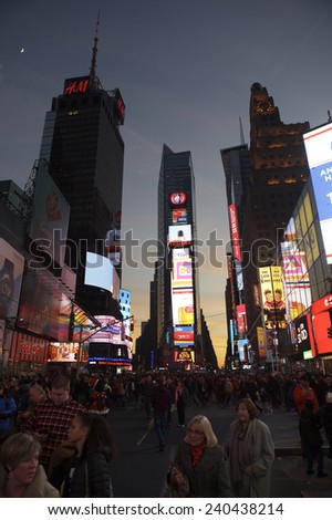 NEW YORK, USA - DECEMBER 27, 2014: The lights of Times Square draw crowds in the build-up to New Year\'s Eve.