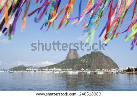 Brazilian wish ribbons flying above scenic view of Sugarloaf Mountain and Botafogo Bay