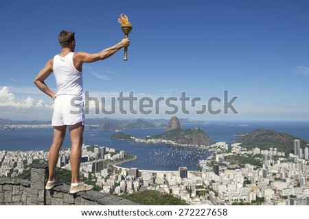 Old-fashioned athlete in classic vintage white sports uniform standing holding sport torch at city skyline overlook in Rio de Janeiro Brazil