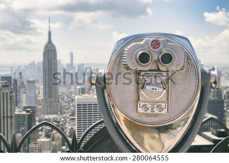 View of Midtown Manhattan New York City with coin-operated telescope on bright sunny day
