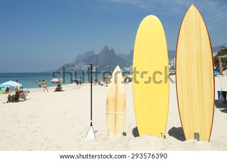 Surfboards and stand up paddle boards line up on the beach at Arpoador, Ipanema, Rio de Janeiro Brazil