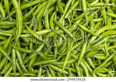 Pile of fresh green chili peppers on display at the Devaraja outdoor market in India