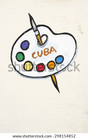 HAVANA, CUBA - JUNE, 2011: Cuba sign wall mural features painter\'s palette with paintbrush and bright colors