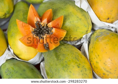 Fresh cut juicy tropical papaya fruit with seeds at Brazilian farmers market in Rio de Janeiro Brazil
