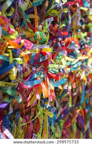 Colorful Brazilian wish ribbons tied to a fence at the Bonfim Church Salvador Bahia Brazil