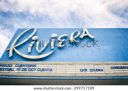 HAVANA, CUBA - MAY, 2011: Vintage sign for the Riviera cinema cinema has changed little since the movie theatre opened in the 1950s.