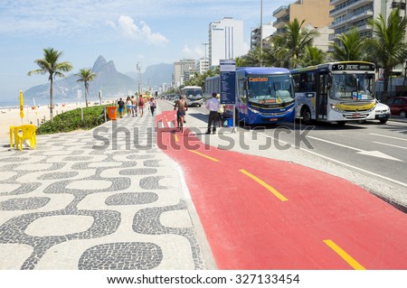RIO DE JANEIRO, BRAZIL - APRIL 1, 2014: Bus stops along boardwalk bike path on Avenida Vieira Souto in Ipanema, recently painted red for safety.