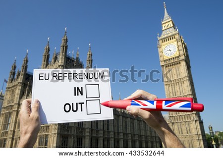 Voter marking a ballot for the referendum on the United Kingdom\'s membership of the European Union leave or remain campaign in front of Houses of Parliament at Westminster Palace, London