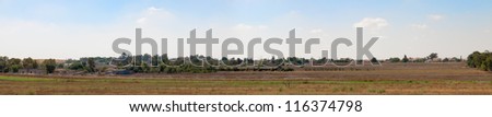 Wide panorama agricultural village in southern Israel isolated on white background