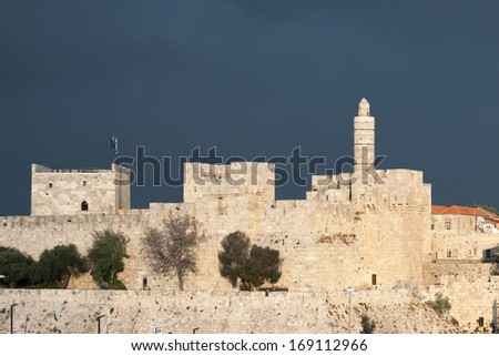 David tower and city wall of Jerusalem, capital of Israel, on a background of a stormy sky