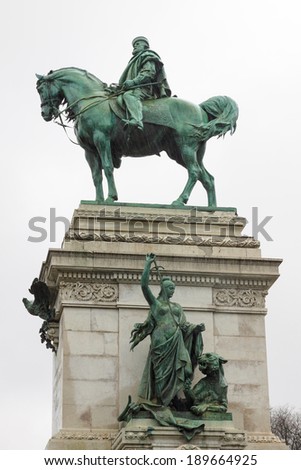 Statue of Garibaldi on horse in Milan under rain