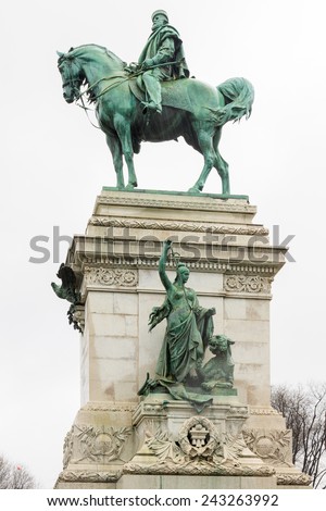 Left side of bronze statue of Garibaldi on horse in Milan under rain on white background