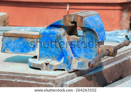 Old blue vise-grip with rust