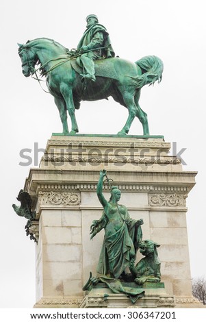 Side view of bronze statue of Garibaldi on horse in Milan under rain on white background