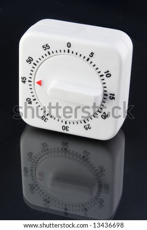 Forty-five countdown kitchen timer with reflection isolated on black background