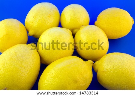Lemons isolated on blue background
