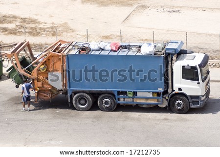 Garbage truck with a worker