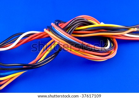 Colored wires from PC power supply isolated on blue background