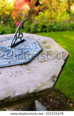Close up of an octagon sundial in an English country garden.
