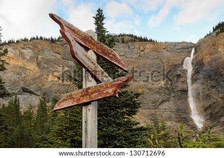 Weathered sign at Takakkaw Falls in Yoho National Park British Columbia Canada.