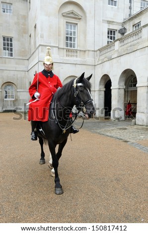 LONDON, GREATER LONDON, ENGLAND - July 14: A mounted trooper of the Household Cavalry guarding the entrance to Horse Guards on July 14, 2012 in London, Greater London, England.