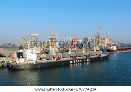 ROTTERDAM, SOUTH HOLLAND, NETHERLANDS - MARCH 28: Ships being loaded and unloaded in the Port of Rotterdam on March 28, 2013 in Rotterdam, South Holland, Netherlands.