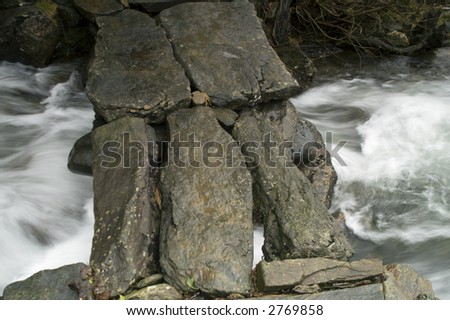 Foot bridge over river in Wales - landscape orientation