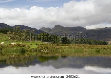 View across farmland to the fells in the Lake District - landscape orientation