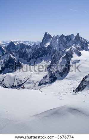 View of Mont Blanc mountain range from Aiguille Du Midi in Chamonix - portrait orientation