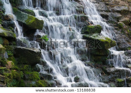 Motion blurred water fall in summer - landscape orientation,