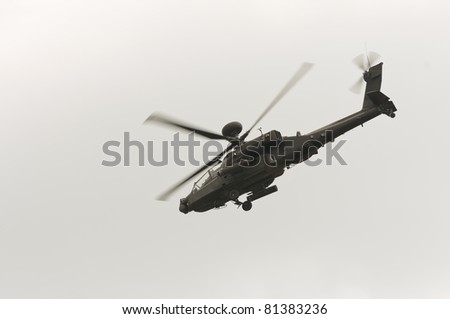 WADDINGTON, ENGLAND, UK - JULY 2: Apache Longbow attack helicopter at Waddington International Air Show on July 2, 2011 in Waddington, England, UK. Flown by WO2 Bruce Allen and Captain Scottie Hewitt.