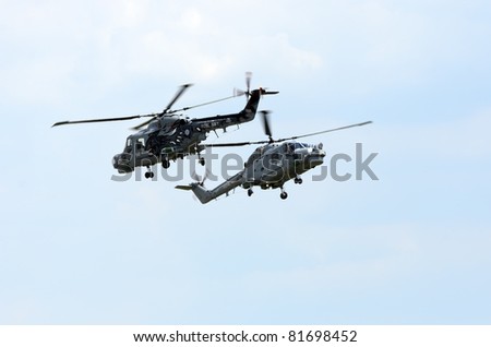 WADDINGTON, ENGLAND, UK - JULY 3: Royal Navy Black Cats helicopter display team at Waddington International Air Show on July 3, 2011 in Waddington, England, UK.