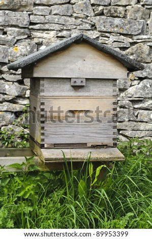 Wooden beehives used for the production of honey in English country garden