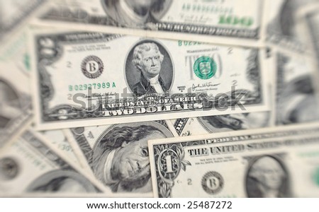 Abstract dollars background (selective focus lens shot)