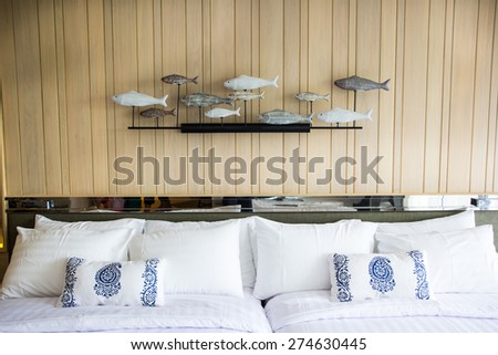 Design of the white pillow covers on the double bed
