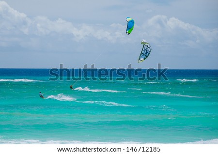 SILVER SAND BEACH - BARBADOS - MARCH 11: Men Kite Surfing off the Coast of Silver Sand Beach. The Winter Tradewinds Make this Area an Ideal Spot for Kite Surfing. Barbados, March 11, 2013.