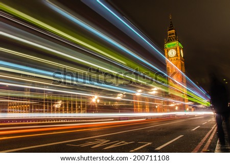 Big Ben at Night with Light Trails Left by Passing Cars and Buses