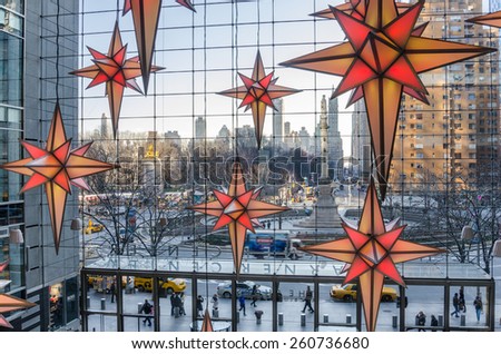 New York, USA - December 27, 2014: Columbus Circle from Time Warner Center with Christmas Decorations in foreground. In the heart of Manhattan, TWC is a place to dine, shop, work and be entertained.