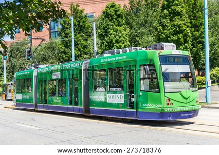 Seattle, WA. USA - July 7, 2014: South Lake Union Line Streetcar at Fairview Stop. The City of Seattle is building a modern streetcar system of which the South Union Lake line is the first segment.
