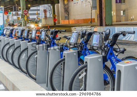 New York, USA - December 29, 2014: Citi Bikes Lined up at South St. & Governeur Ln Station in Manhattan. The Citi Bike system features thousands of bikes at hundreds of stations around New York.
