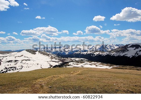 Alpine Tundra and Mountain Landscape under a Blue Sky