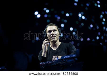 GOTHENBURG, SWEDEN - AUGUST 13: TiÃ«sto performs a live DJ set at the Way Out West festival on August 13, 2011 in Gothenburg, Sweden. His show featured flames, fireworks and confetti.