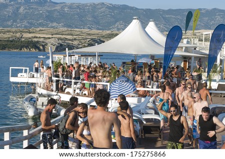 CROATIA, PAG Island - AUGUST 5, 2011: Big crowd of swimmers partying on a hot summer day on Zrce beach, Novalja, Pag island, Croatia, Adriatic sea. Zrce beach is the most popular party destinations