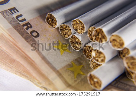 Heap of cigarettes on euro bills
