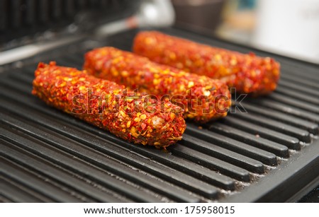 Cevapi or cevapcici - a grilled dish of minced meat (beef, pork and lamb). It's a type of kebab, found traditionally in the countries of southeastern Europe