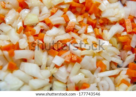 Closeup of chopped vegetables - carrot, onion, garlic.