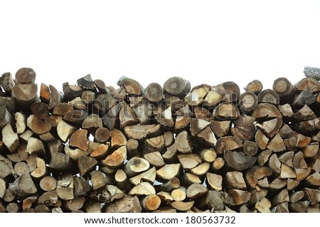 Pine wood logs stacked up in a pile isolated on white background