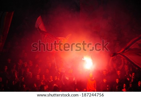 SERBIA, BELGRADE - APRIL 12, 2014: Soccer or football fans celebrating goal using pyrotechnics during Serbian championship soccer game between Red Star Belgrade and Cukaricki